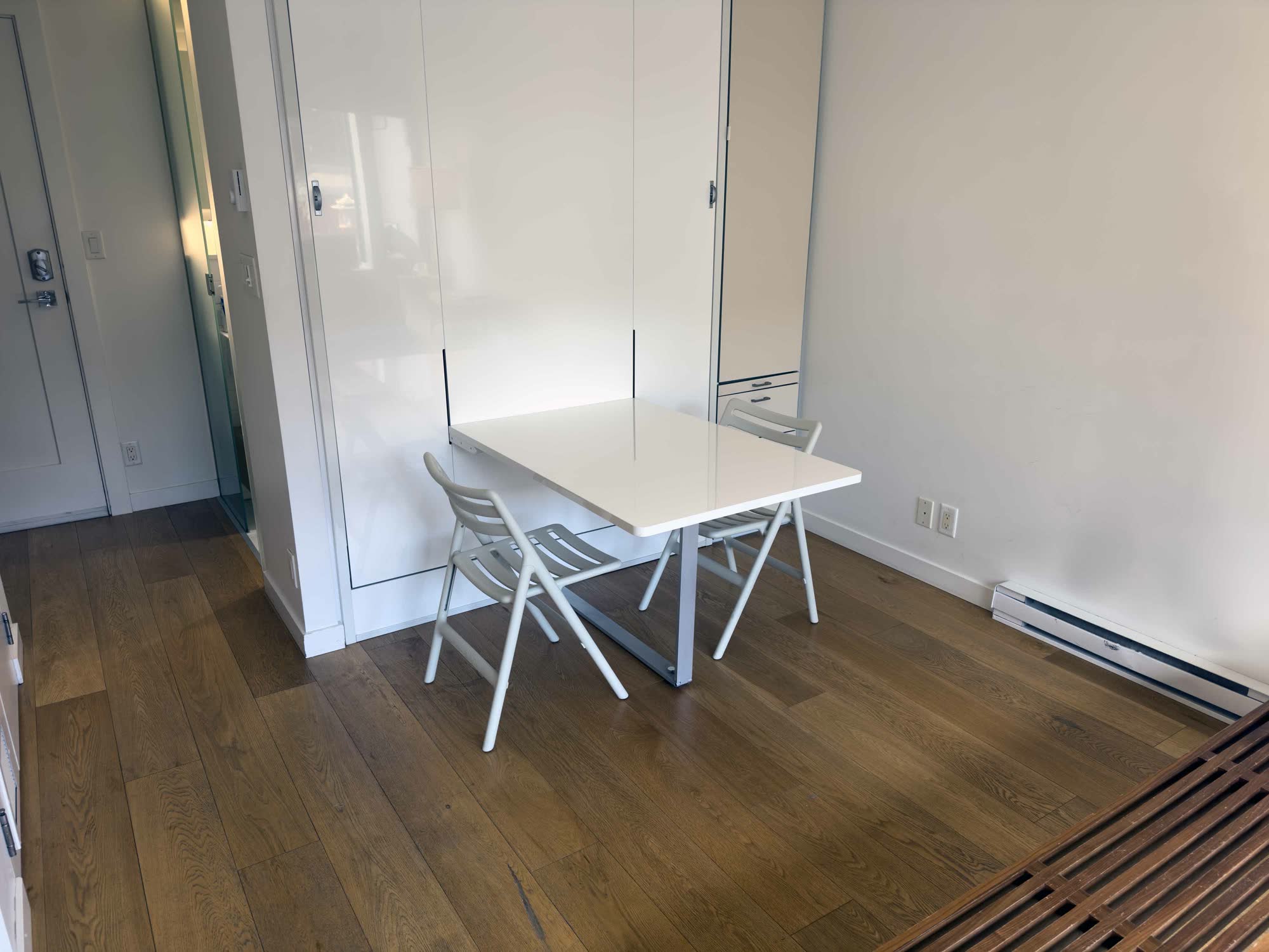 Fold-down dining table with two chairs